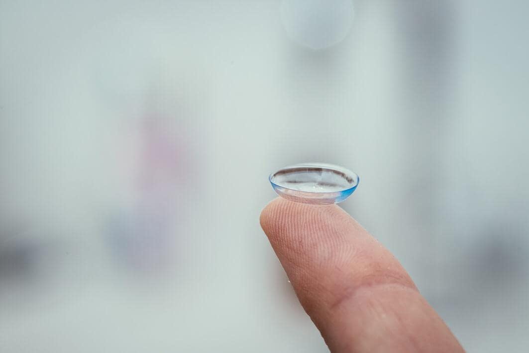 kids contact lenses, contact lens on finger